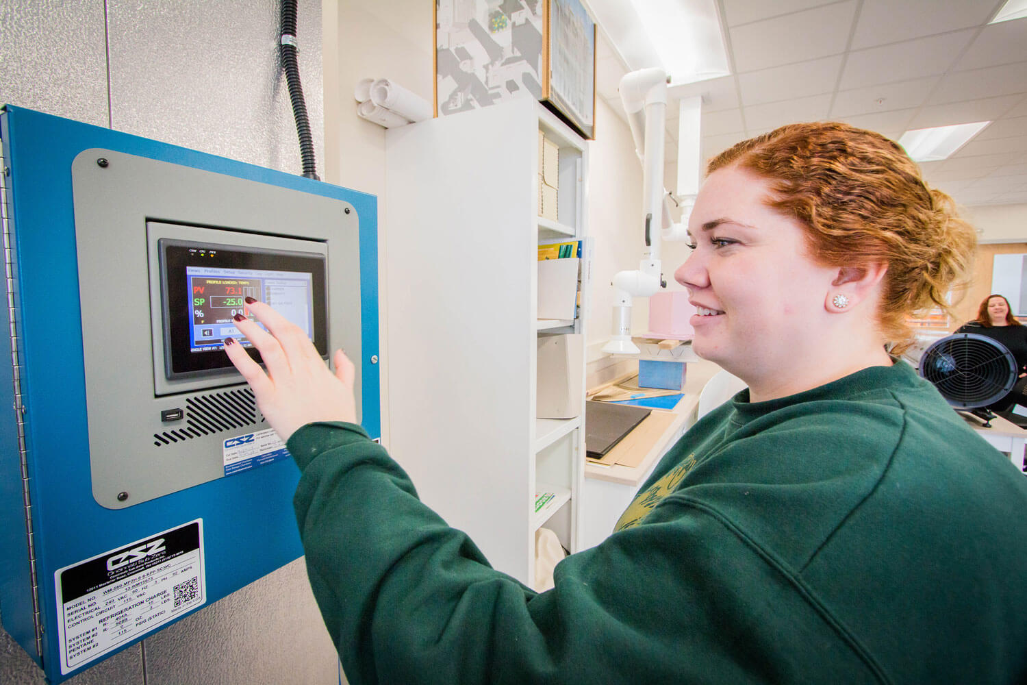 A student working in the Sustainable Building Materials Lab - Environmental Chamber.